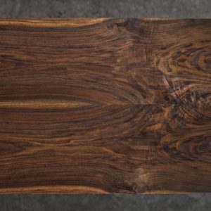 A top view of a book matched walnut tabletop