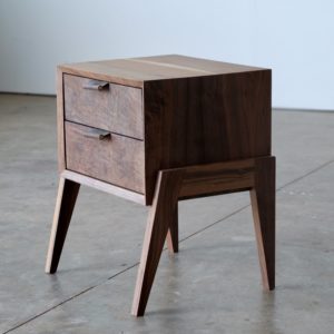 A two drawer nightstand made of solid walnut